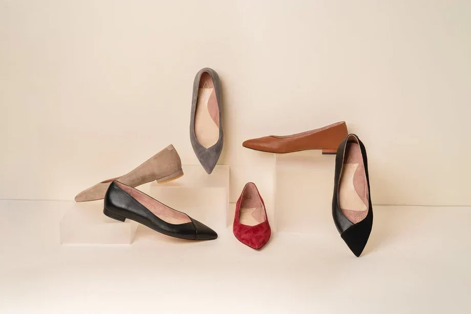 Collection of ALLY pointed-toe flats in black, camel, taupe, burgundy, and suede finishes, showcasing versatile styles for work and everyday wear.
