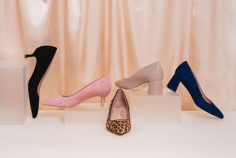 An assortment of various-style shoes from ALLY on display. 