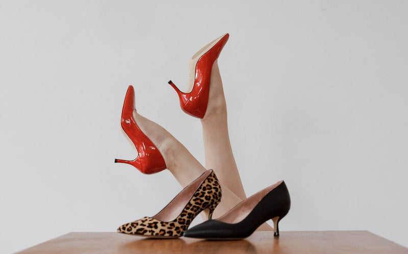 A display of ALLY shoes in various colors. 