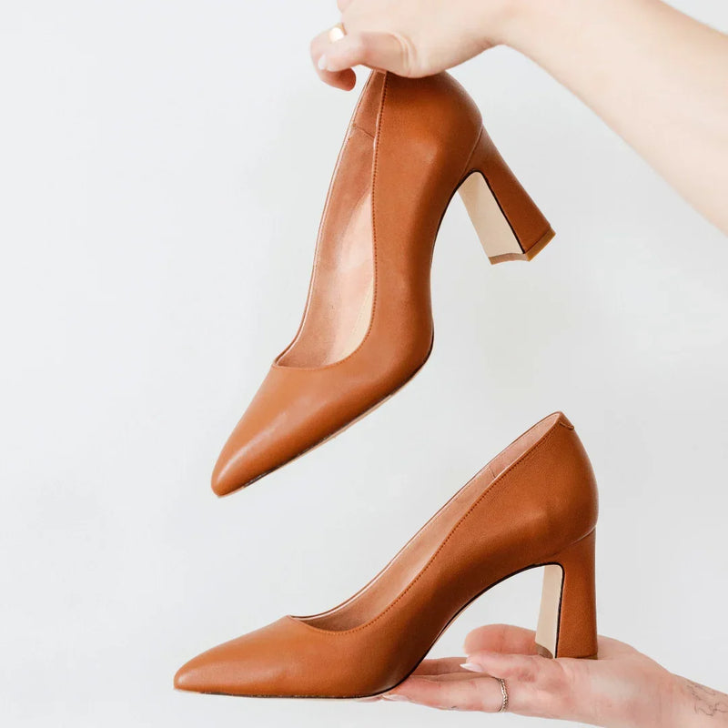 ALLY tan leather block heel pumps with pointed toes, showcasing elegant design and built-in arch support for all-day comfort.
